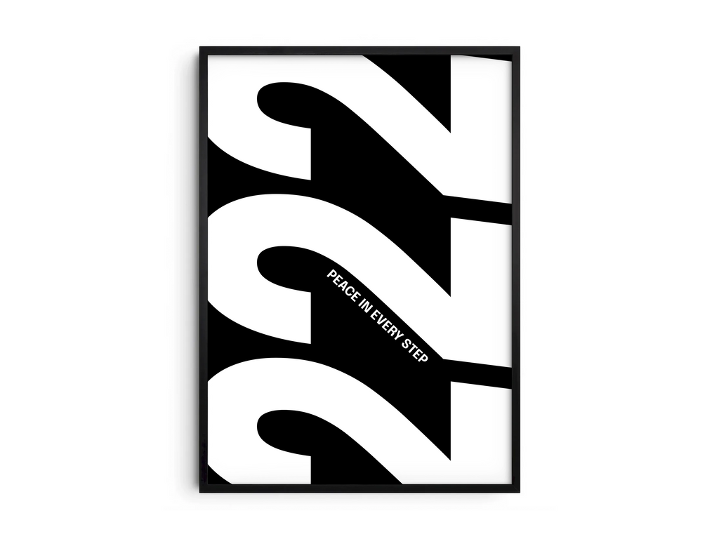 Minimalist black and white abstract poster featuring the repeated number 222 design and the quote "Peace in every step," framed and leaning against a white wall. Inspiring modern wall art for a peaceful, contemporary home or office interior.