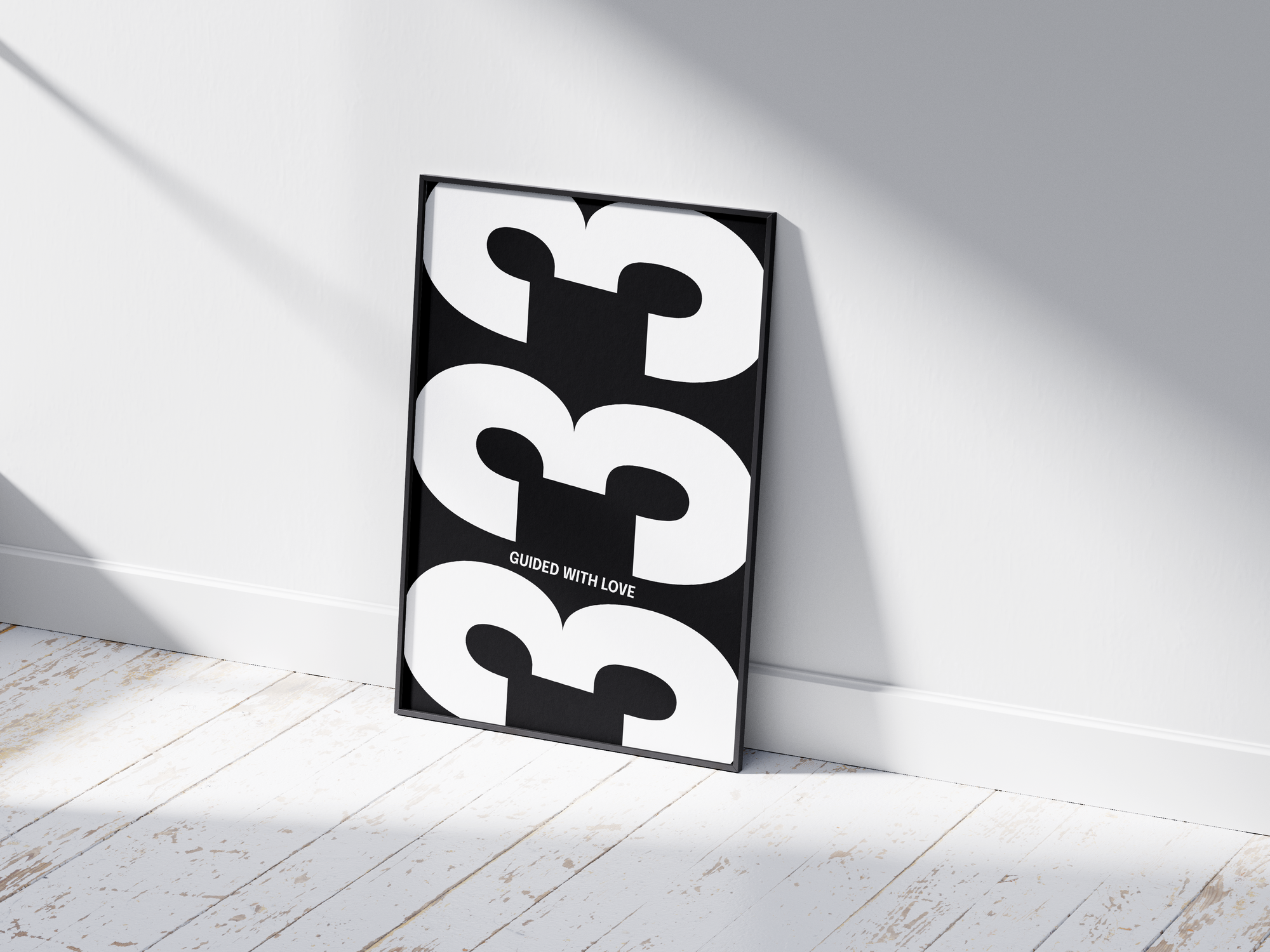 Minimalist black and white abstract poster featuring the repeated number 333 design and the quote "Guided with love," framed and leaning against a white wall. Inspiring modern wall art for a creative, contemporary home or office interior.