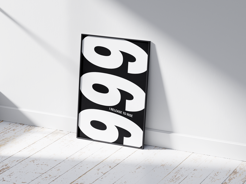 Minimalist black and white abstract poster featuring the repeated number 999 design and the quote "I release to rise," framed and leaning against a white wall. Inspiring modern wall art for a transformative, contemporary home or office interior.