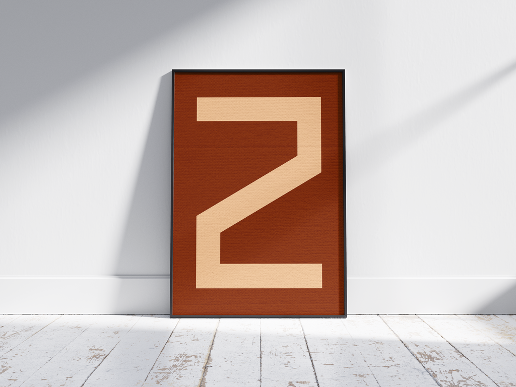Bold geometric alphabet letter Z poster, featuring a creamy light peach 'Z' on a deep dark brown/burnt sienna background. Perfect modern wall art for offices, studies, or gallery walls with a graphic, confident, and earthy aesthetic.