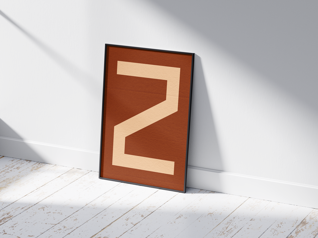 Bold geometric alphabet letter Z poster, featuring a creamy light peach 'Z' on a deep dark brown/burnt sienna background. Perfect modern wall art for offices, studies, or gallery walls with a graphic, confident, and earthy aesthetic.