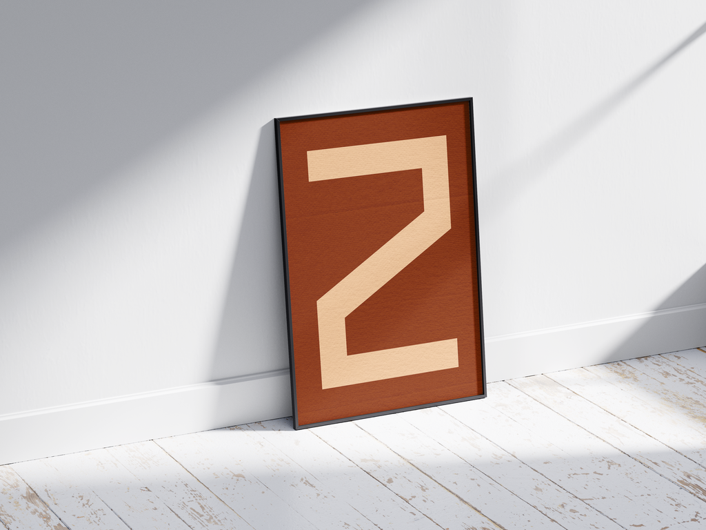 Bold geometric alphabet letter Z poster, featuring a creamy light peach 'Z' on a deep dark brown/burnt sienna background. Perfect modern wall art for offices, studies, or gallery walls with a graphic, confident, and earthy aesthetic.
