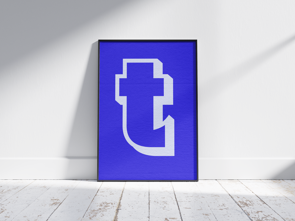 Bold and deconstructed geometric alphabet letter T poster, featuring an off-white fragmented 't' outline on an electric blue background. Perfect modern wall art for studios, offices, or gallery walls with a sharp, graphic, and contemporary aesthetic.