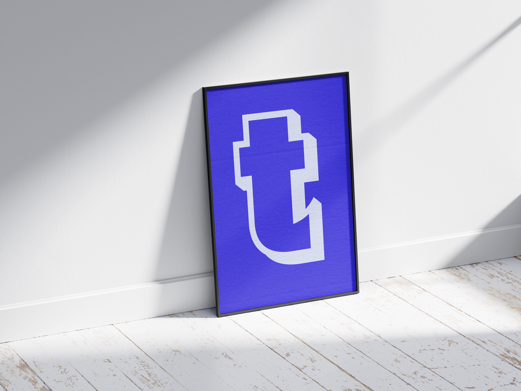 Bold and deconstructed geometric alphabet letter T poster, featuring an off-white fragmented 't' outline on an electric blue background. Perfect modern wall art for studios, offices, or gallery walls with a sharp, graphic, and contemporary aesthetic.
