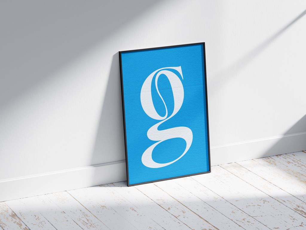 Elegant and classic alphabet letter G poster, featuring a flowing white serif 'g' on a bright sky-blue background. Perfect sophisticated wall art for libraries, offices, or gallery walls with a timeless, graceful, and classic typography aesthetic.