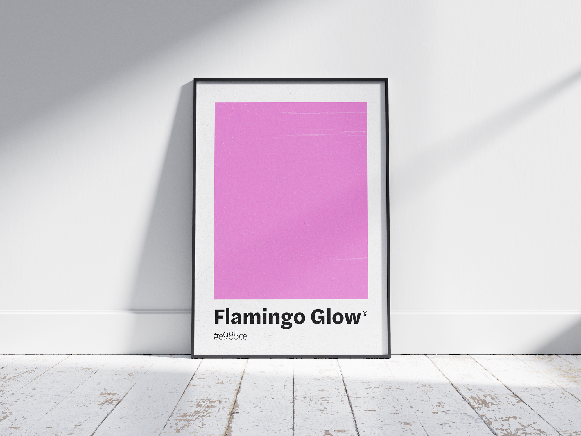 Minimalist pink color swatch poster featuring the unique shade "Flamingo Glow" with its hexadecimal code #e985ce. This modern art print is ideal for adding a sophisticated and vibrant touch to contemporary interiors, bedrooms, or gallery walls.