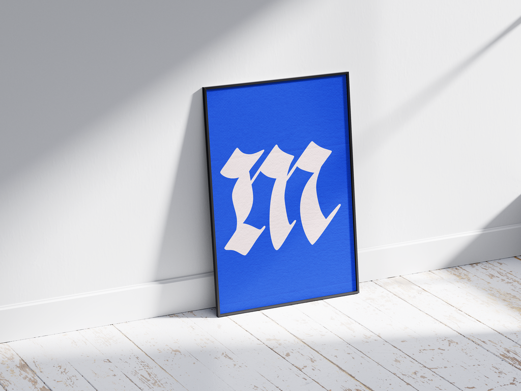 Dramatic and elegant Gothic calligraphy alphabet letter M poster, featuring a creamy white blackletter 'm' on a bright electric-blue background. Perfect wall art for libraries, sophisticated offices, or gallery walls with a vintage, historic, and bold aesthetic.