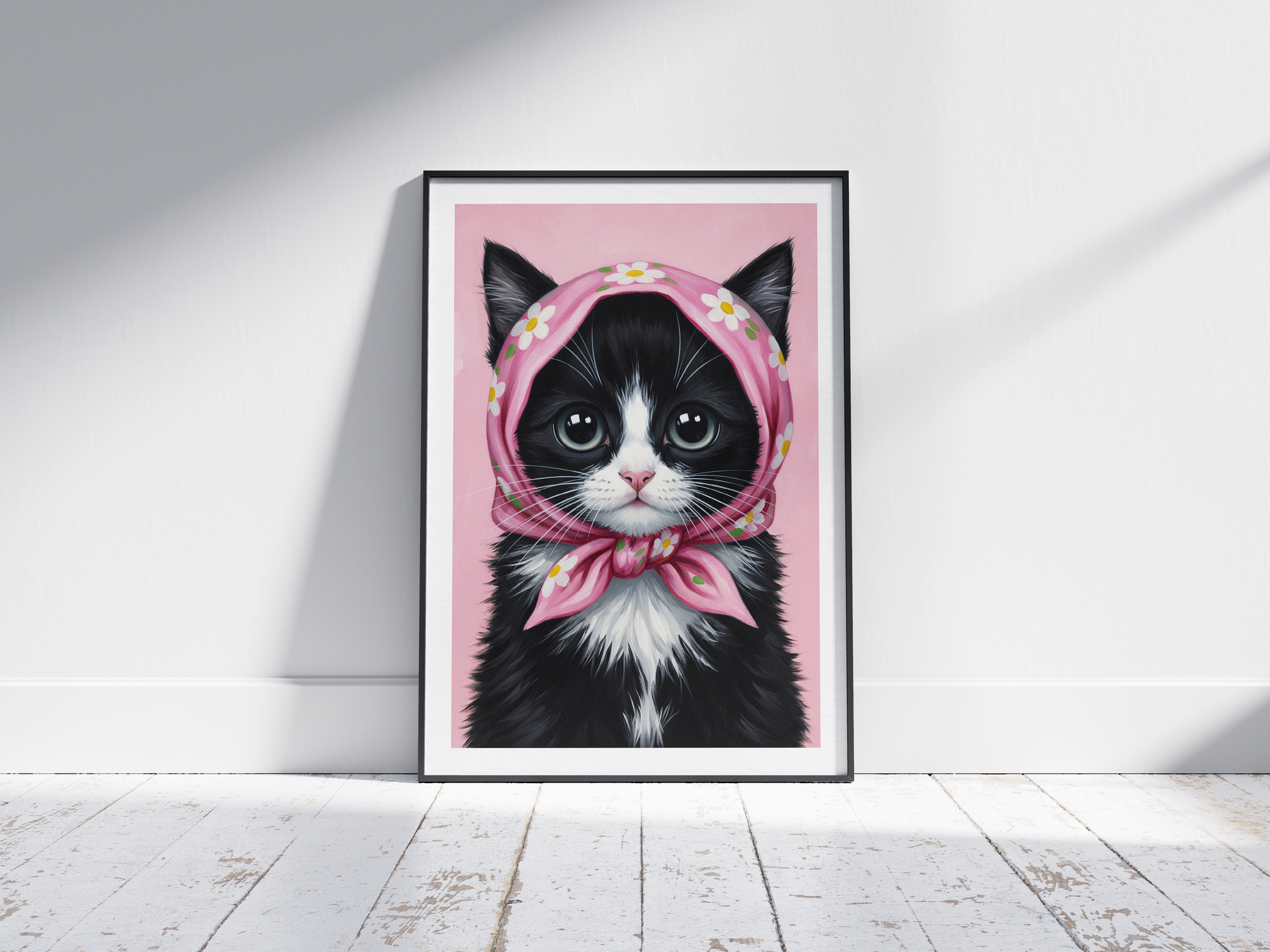 A single framed poster of a black and white kitten wearing a pink, floral babushka scarf. This whimsical art print is ideal for a nursery, kid's room, or bedroom, adding a cozy and charming touch.