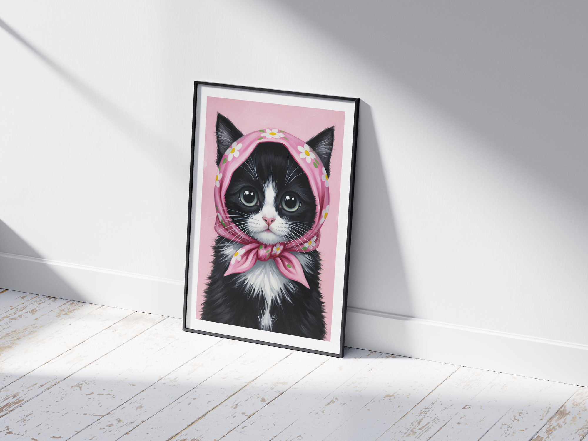 A single framed poster of a black and white kitten wearing a pink, floral babushka scarf. This whimsical art print is ideal for a nursery, kid's room, or bedroom, adding a cozy and charming touch.