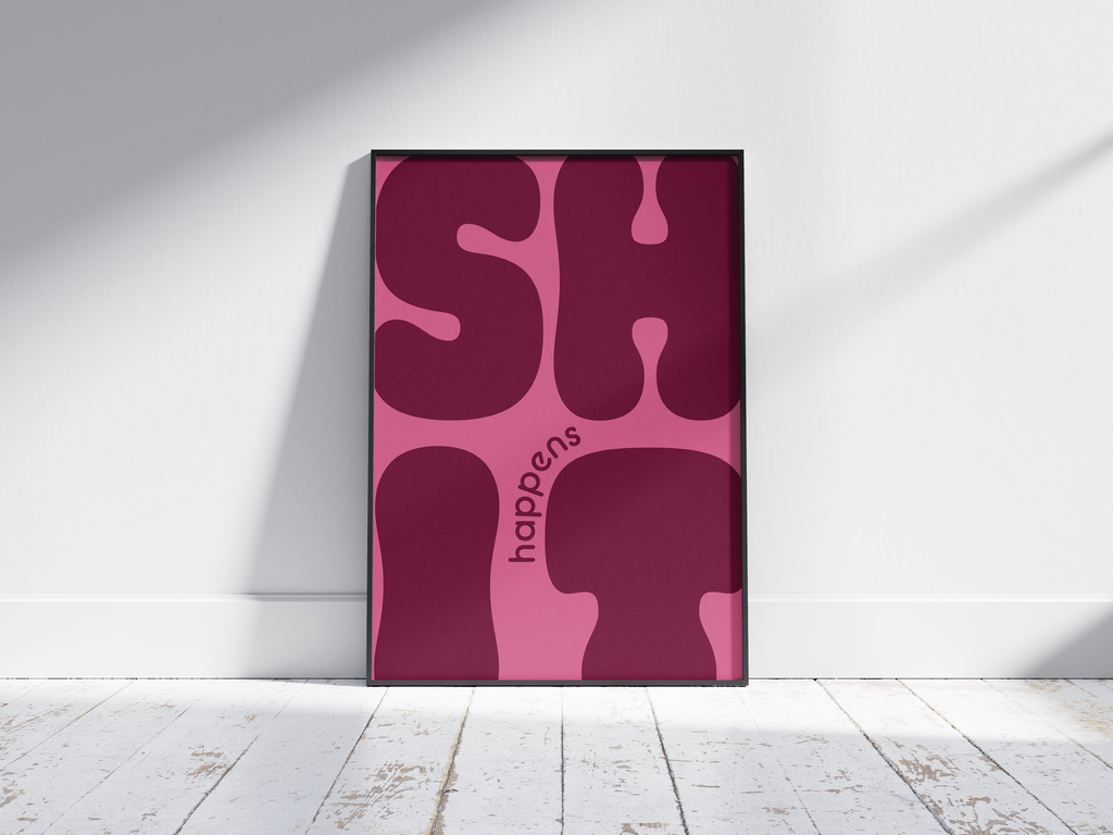 Bold "Shit Happens" modern art poster featuring large, wavy purple typography on a pink background, printed on semi-gloss sustainable paper. Perfect wall art for living rooms, offices, or contemporary interiors with a humorous and confident aesthetic.