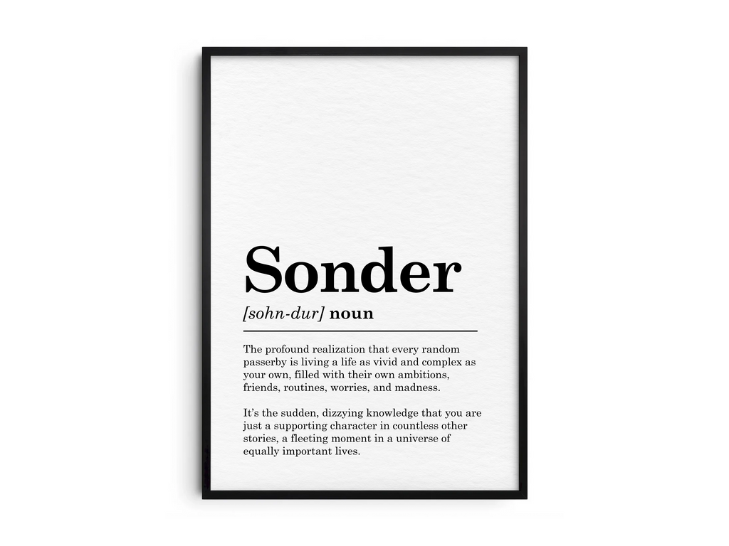 Minimalist Sonder definition poster featuring elegant black text on a crisp white background. This powerful and thought-provoking piece of wall art is perfect for adding a sense of perspective and empathy to living rooms, studies, or gallery walls with a modern or minimalist aesthetic.