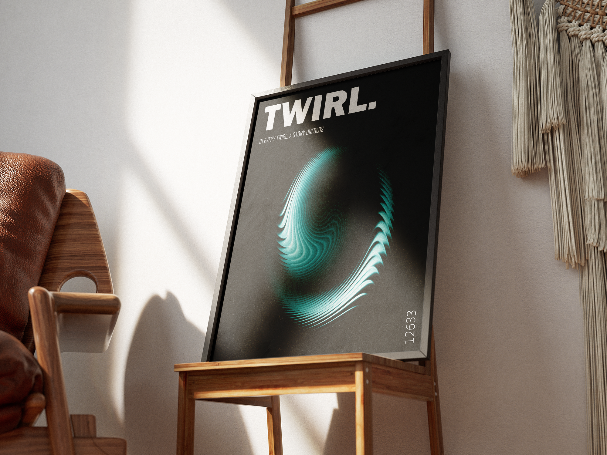 A modern, dark abstract art print featuring a glowing, turquoise-blue and white swirling, dynamic motion graphic with the bold text "TWIRL." and the philosophical line "IN EVERY TWIRL, A STORY UNFOLDS." This minimalist piece is excellent for a contemporary living room, study, or creative studio. The framed poster is resting on a wooden chair next to a leather and wood armchair, with a macrame wall hanging in the background.