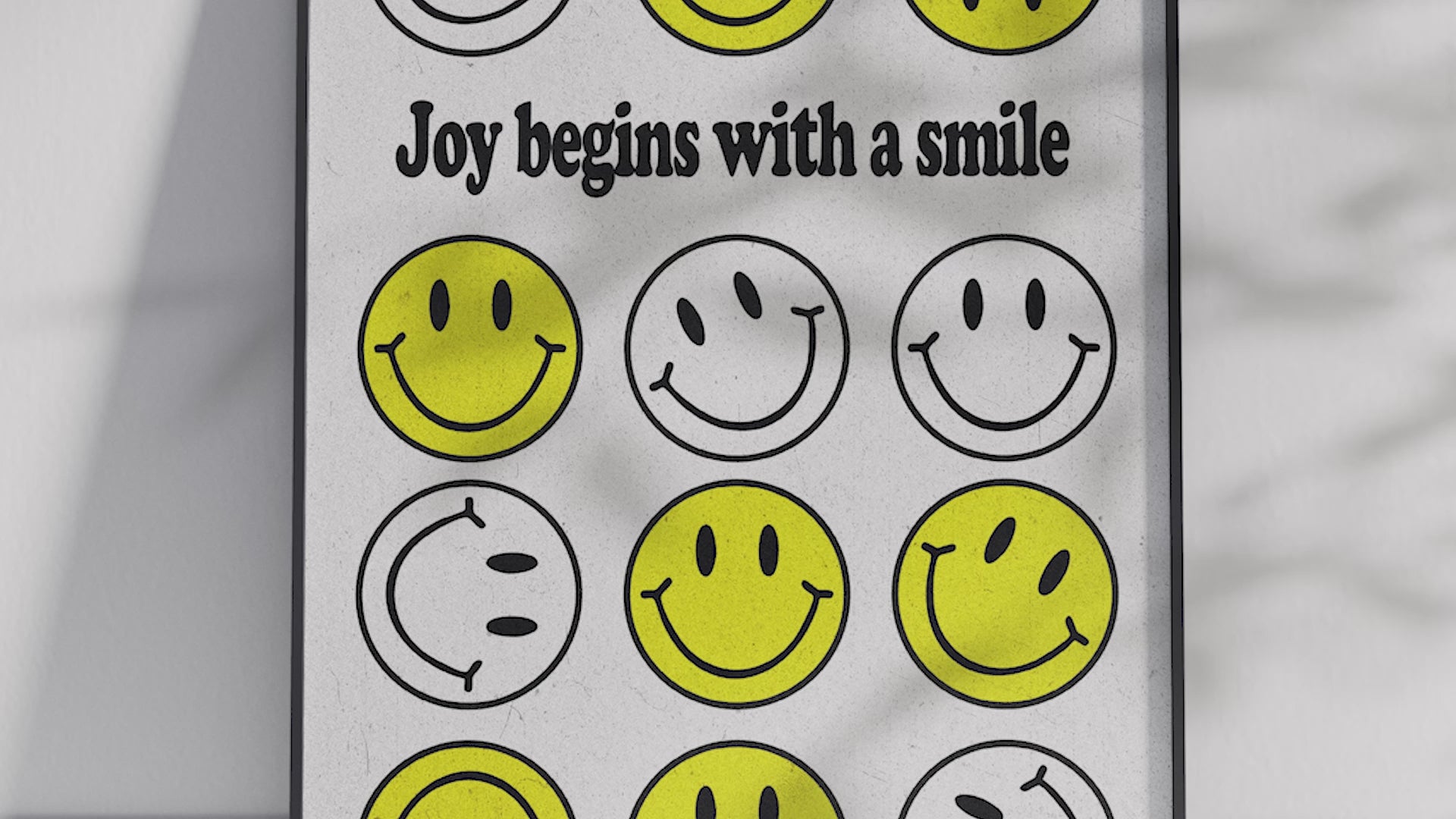 Vibrant "Bright Smiley Grid Quote Art Poster" featuring the text "Joy begins with a smile" and a structured grid of yellow and outlined smiley faces. Printed on semi-gloss sustainable paper, this modern motivational wall art is perfect for living rooms, bedrooms, or offices, encouraging positivity and happiness.