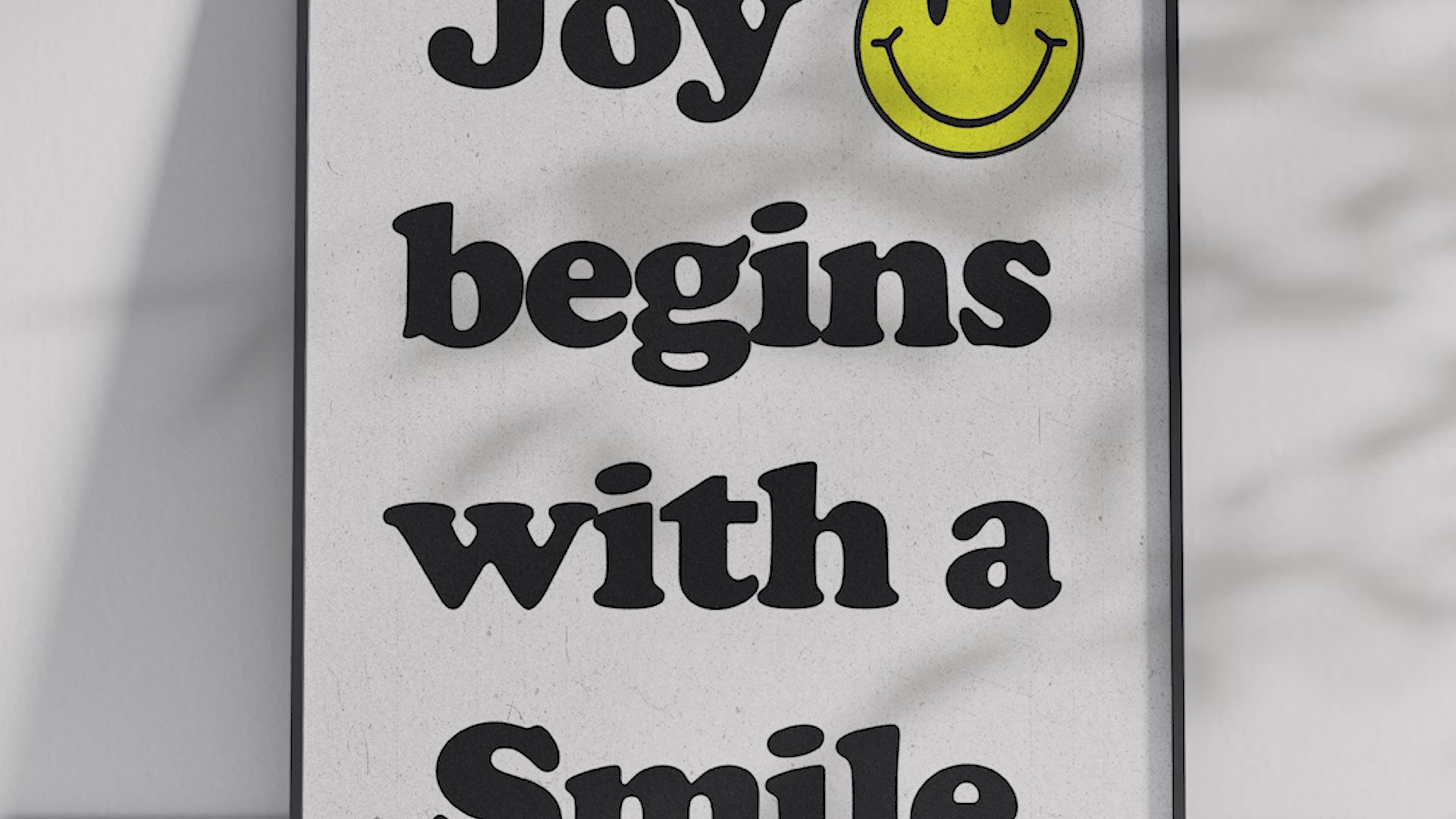 Vibrant "Bright Smiley Quote Art Poster" featuring the text "Joy begins with a Smile" and a yellow smiley icon. Printed on semi-gloss sustainable paper, this modern motivational wall art is perfect for living rooms, bedrooms, or offices, encouraging positivity and happiness.